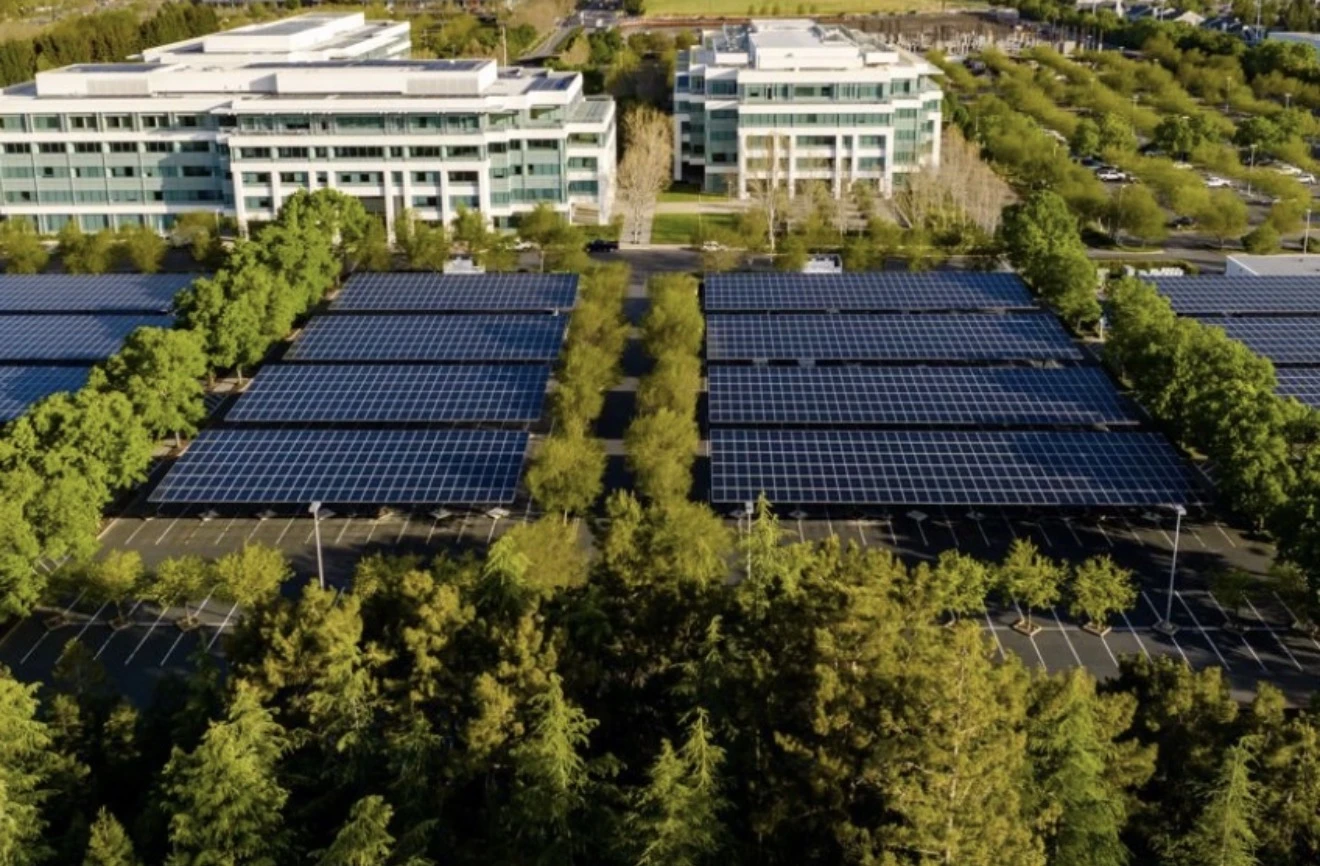 Aerial view of solar canopies spanning an office campus parking lot